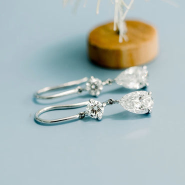 1.30 TCW Pear & Round Cut Moissanite Duet Drop Earrings in Gold 2