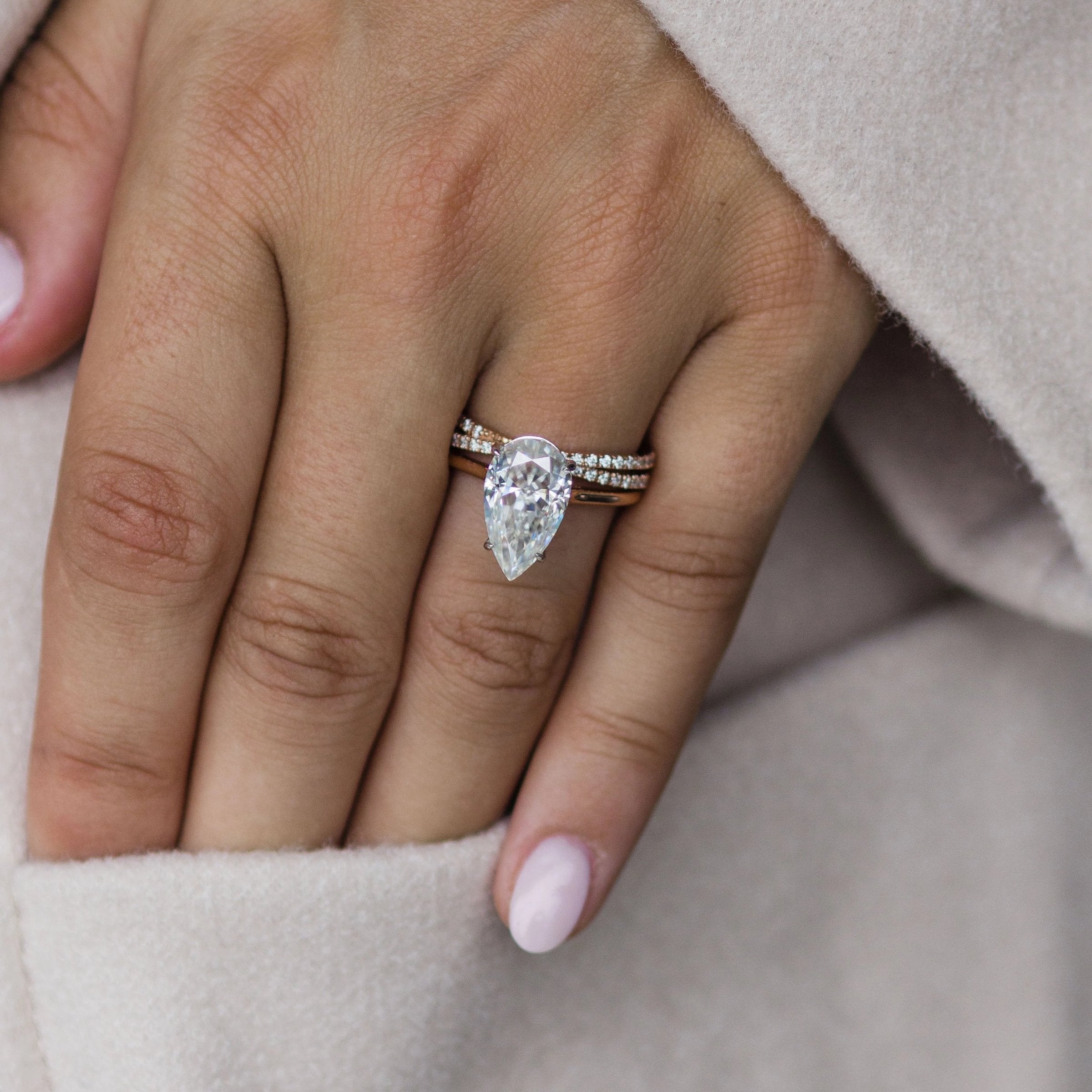 4.50 CT Pear Moissanite Ring Featuring Bridge Style 1