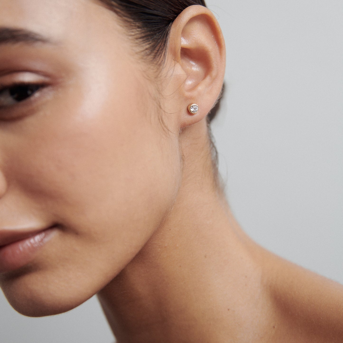 0.20 TCW Round Cut Moissanite Bezel Earrings in Gold 3